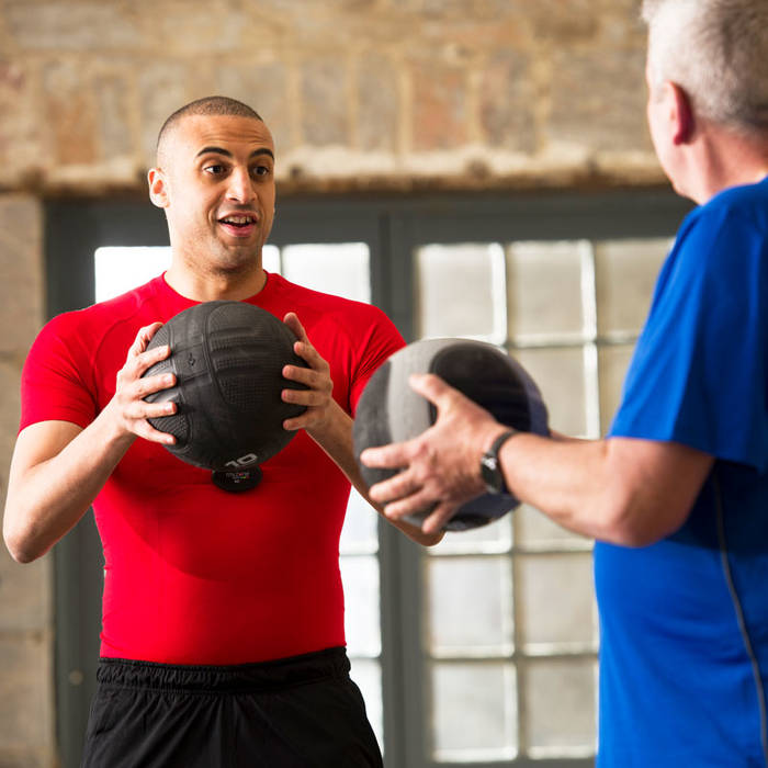 Fitness First members using medicine balls