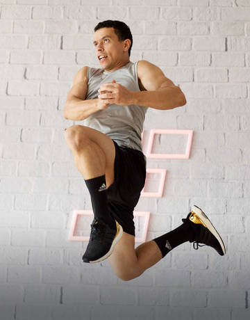 fitness first member jumping in a martial arts class