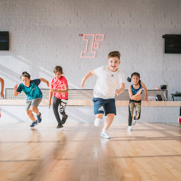 Kids running in Fitness First workout studio