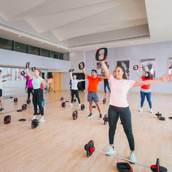 Fitness First members during a group workout Fitness First members during a group workout