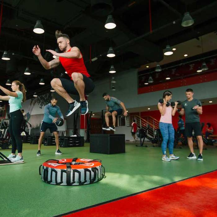 Fitness First members while performing multiple types of exercises Fitness First members while performing multiple types of exercises